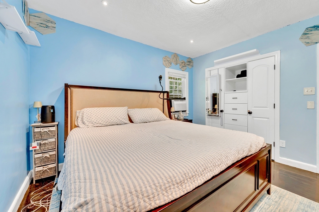 295 Harkness Avenue Springfield, MA 01118 - Photo 19 of 39 a bedroom with a bed and a cabinets