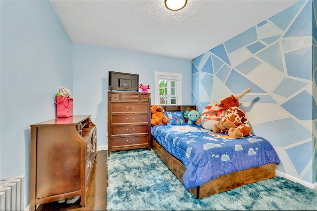 295 Harkness Avenue Springfield, MA 01118 - Photo 21 of 39 a bedroom with a bed and closet