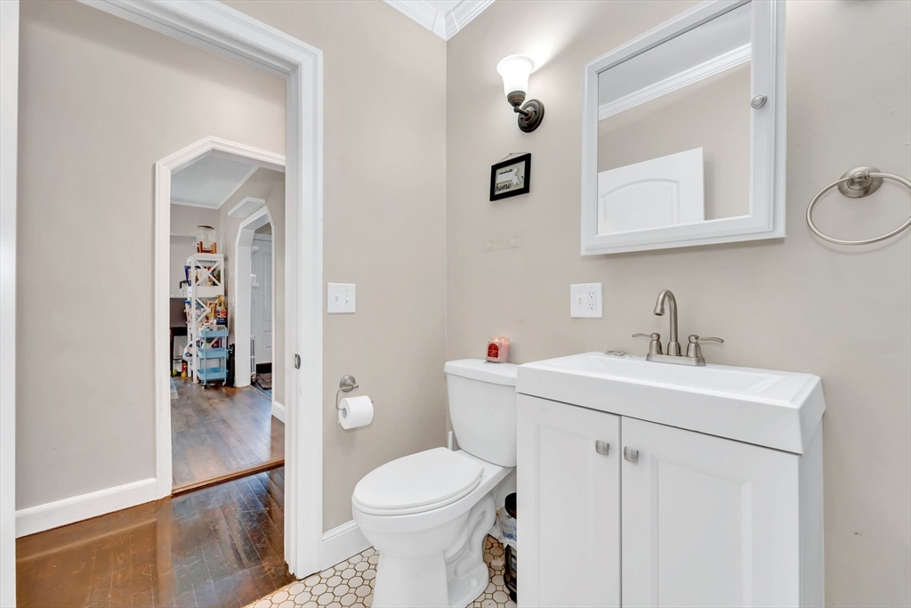 295 Harkness Avenue Springfield, MA 01118 - Photo 23 of 39 a bathroom with a sink toilet and mirror