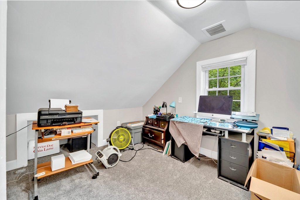 295 Harkness Avenue Springfield, MA 01118 - Photo 27 of 39 a view of a workspace with furniture and a window