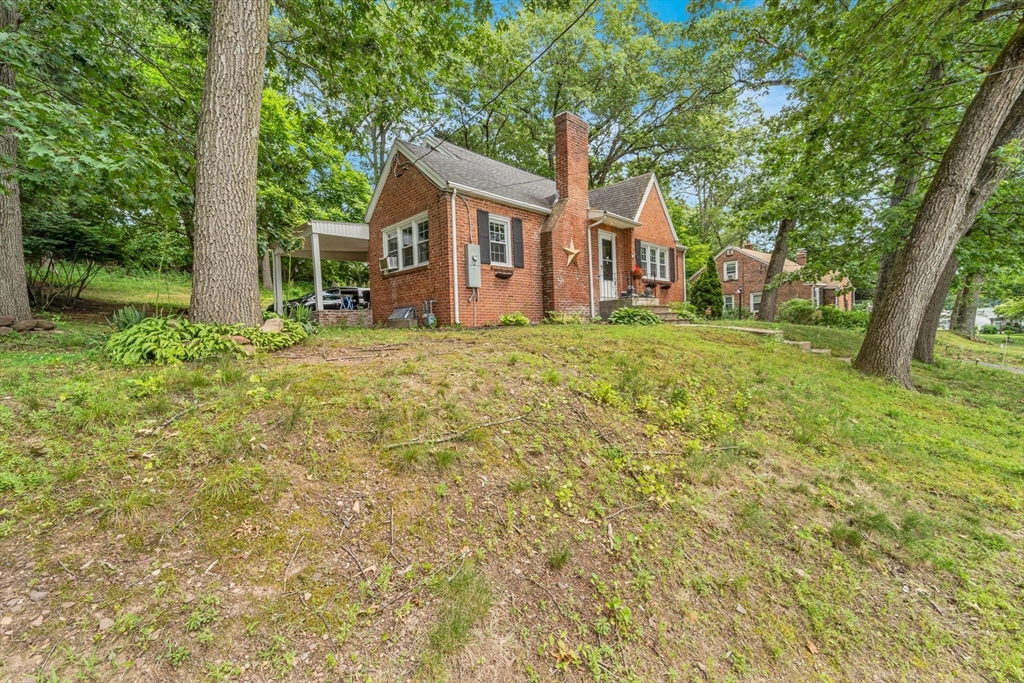 295 Harkness Avenue Springfield, MA 01118 - Photo 32 of 39 front view of a house with a yard