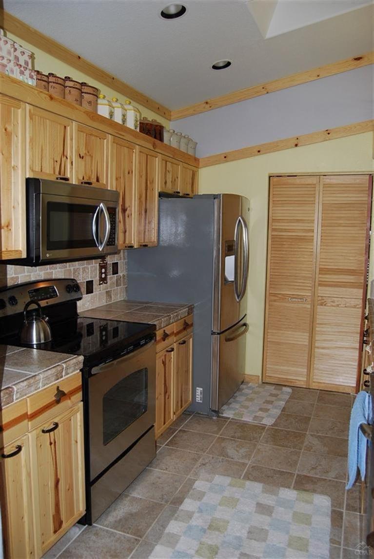 9343 Southwest Meadow Road Terrebonne, OR 97760 - Photo 10 of 23 Stainless appliances, custom solid wood