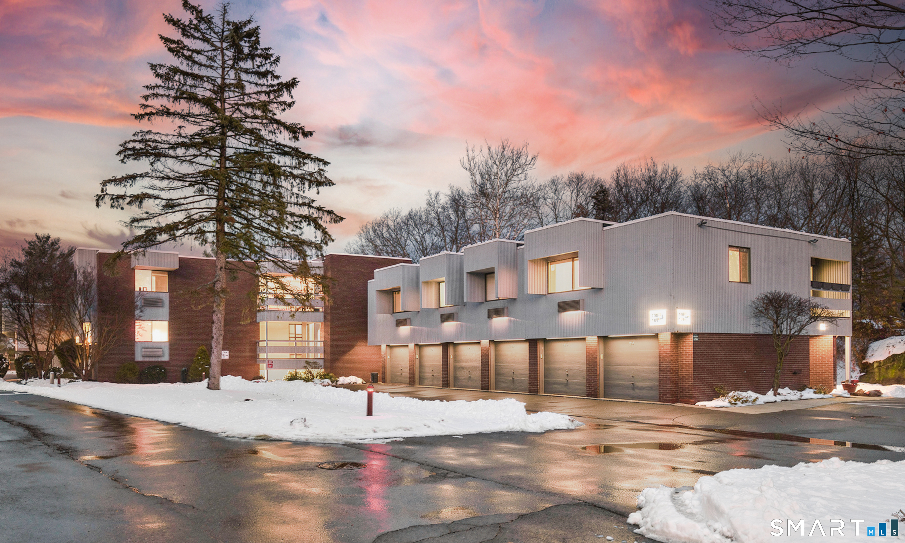 a view of a building with a snow on the road