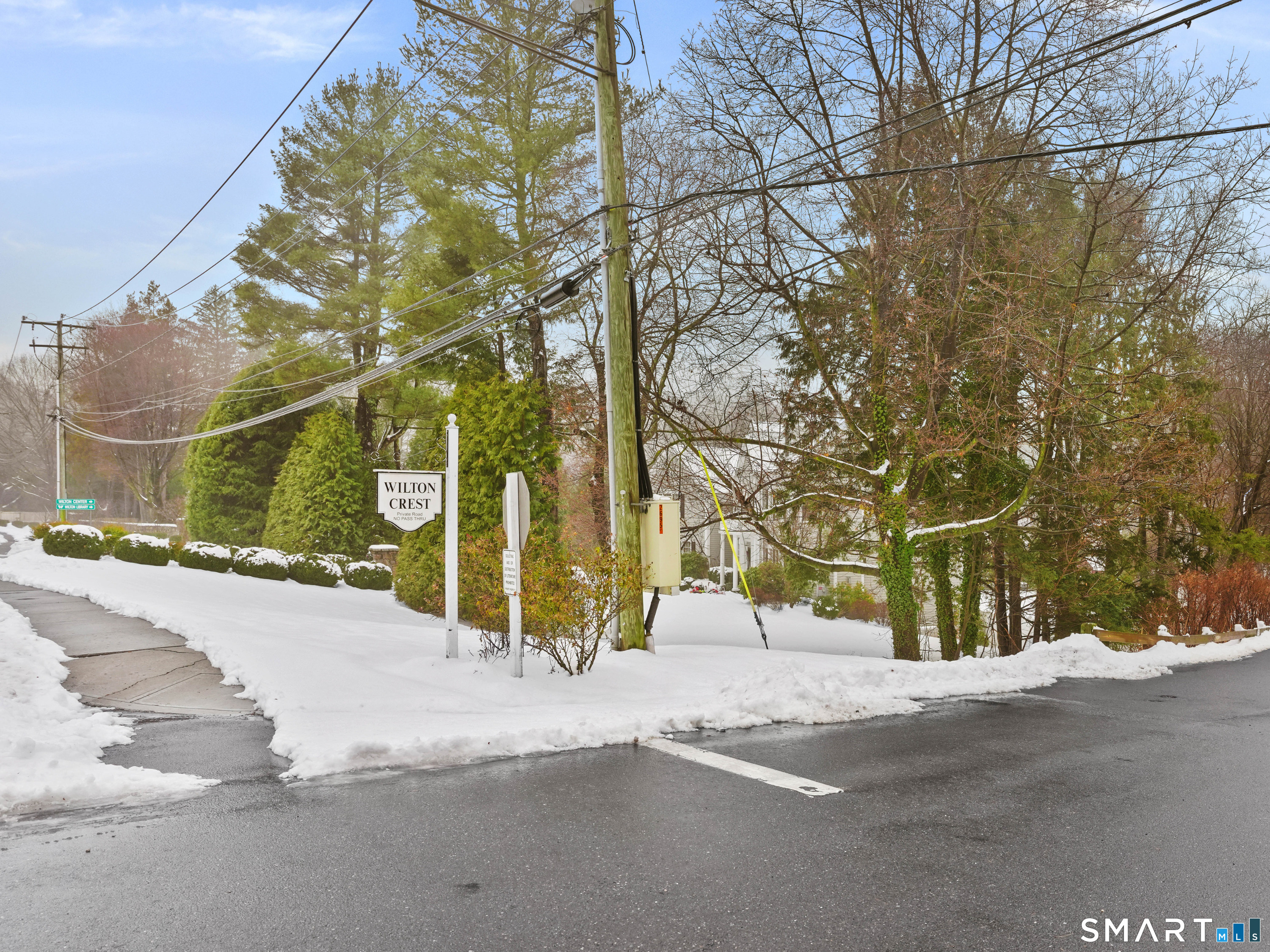 92 Wilton Crest Road Wilton, CT 06897 - Photo 17 of 20 a view of a street with a building in the background