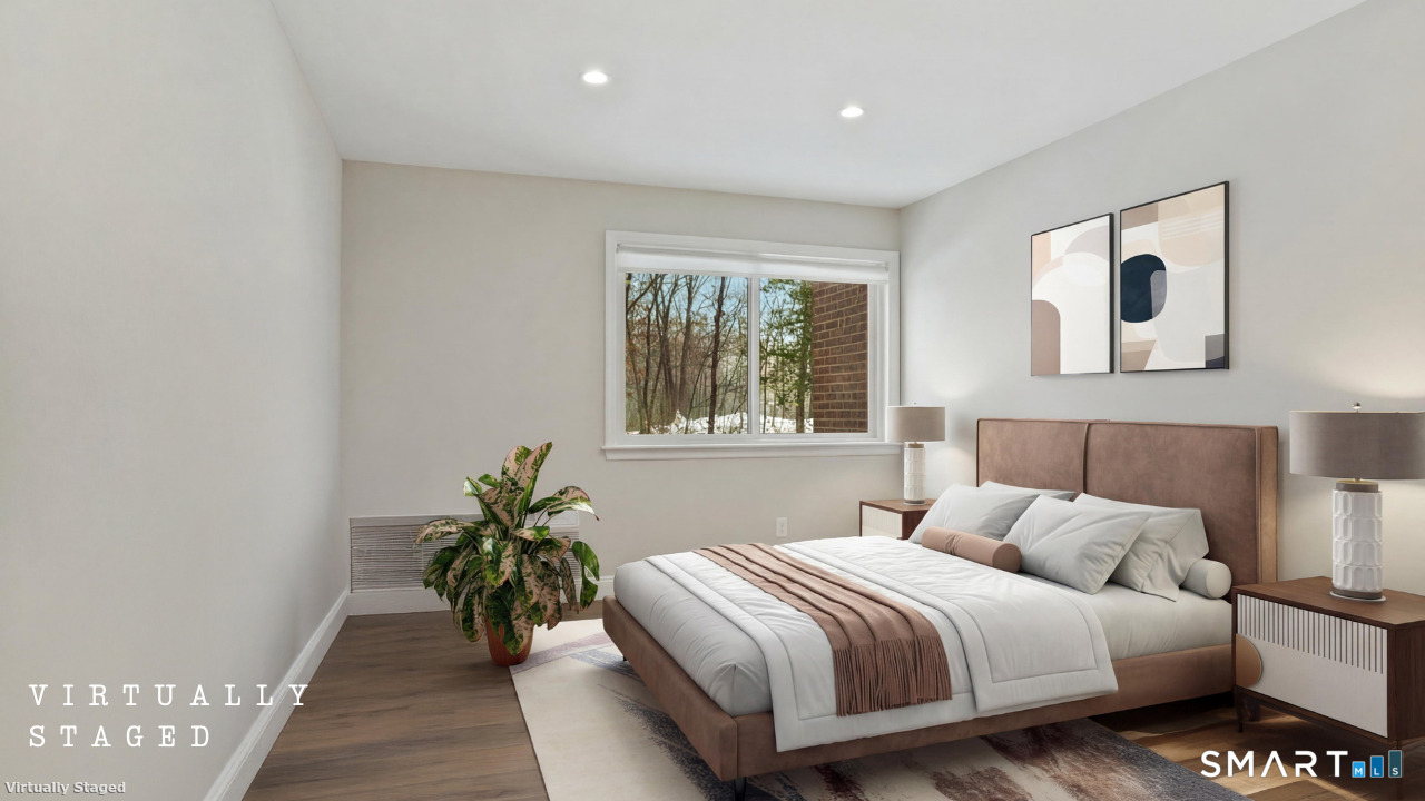 92 Wilton Crest Road Wilton, CT 06897 - Photo 9 of 19 a bedroom with a bed and a potted plant