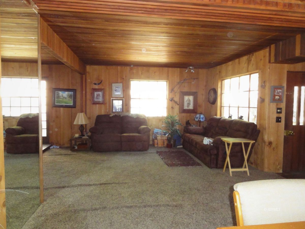 24945 Fern Valley Road Idyllwild, CA 92549 - Photo 12 of 28 a living room with a couch and a table