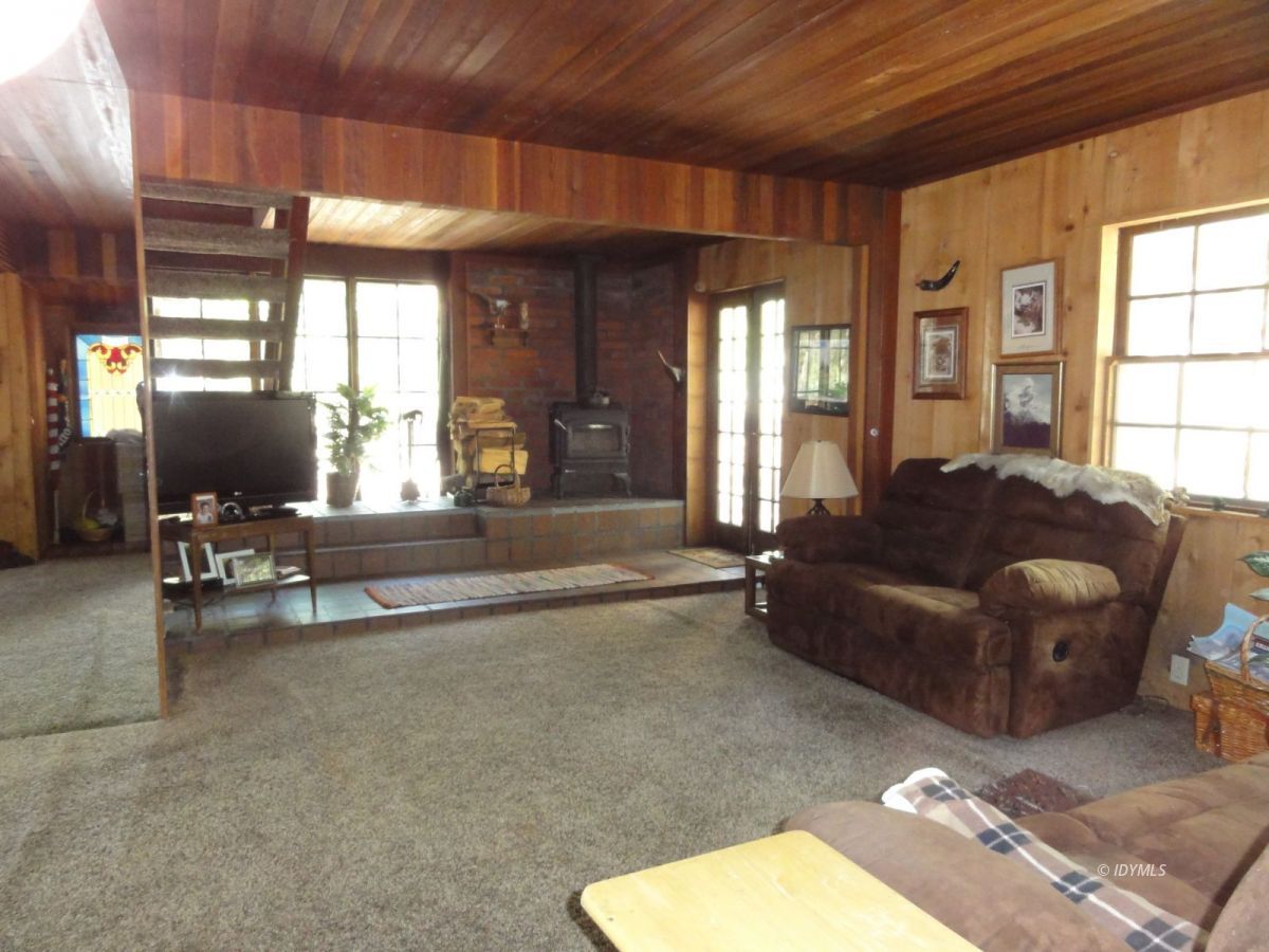 24945 Fern Valley Road Idyllwild, CA 92549 - Photo 14 of 28 a living room with furniture and a large window