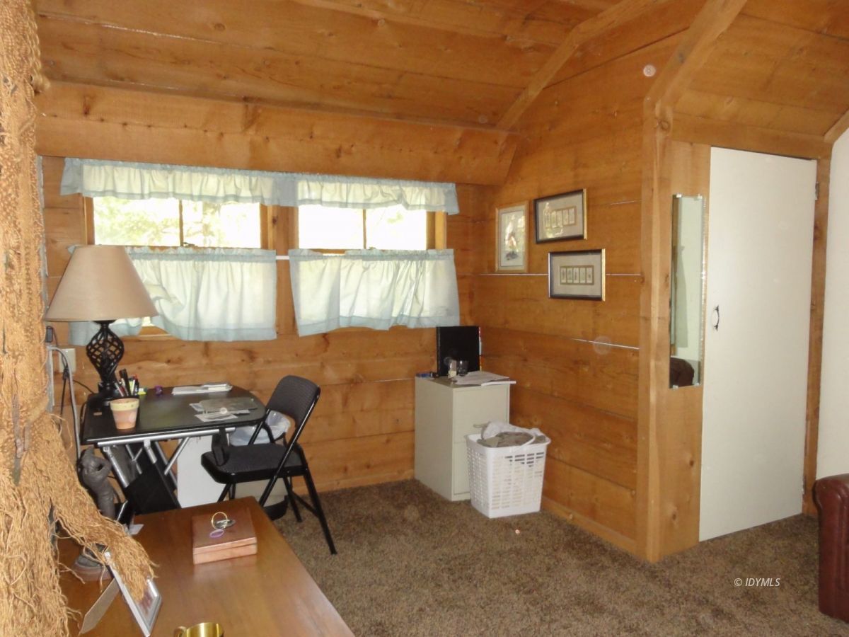 24945 Fern Valley Road Idyllwild, CA 92549 - Photo 20 of 28 a view of a workspace with furniture and a window
