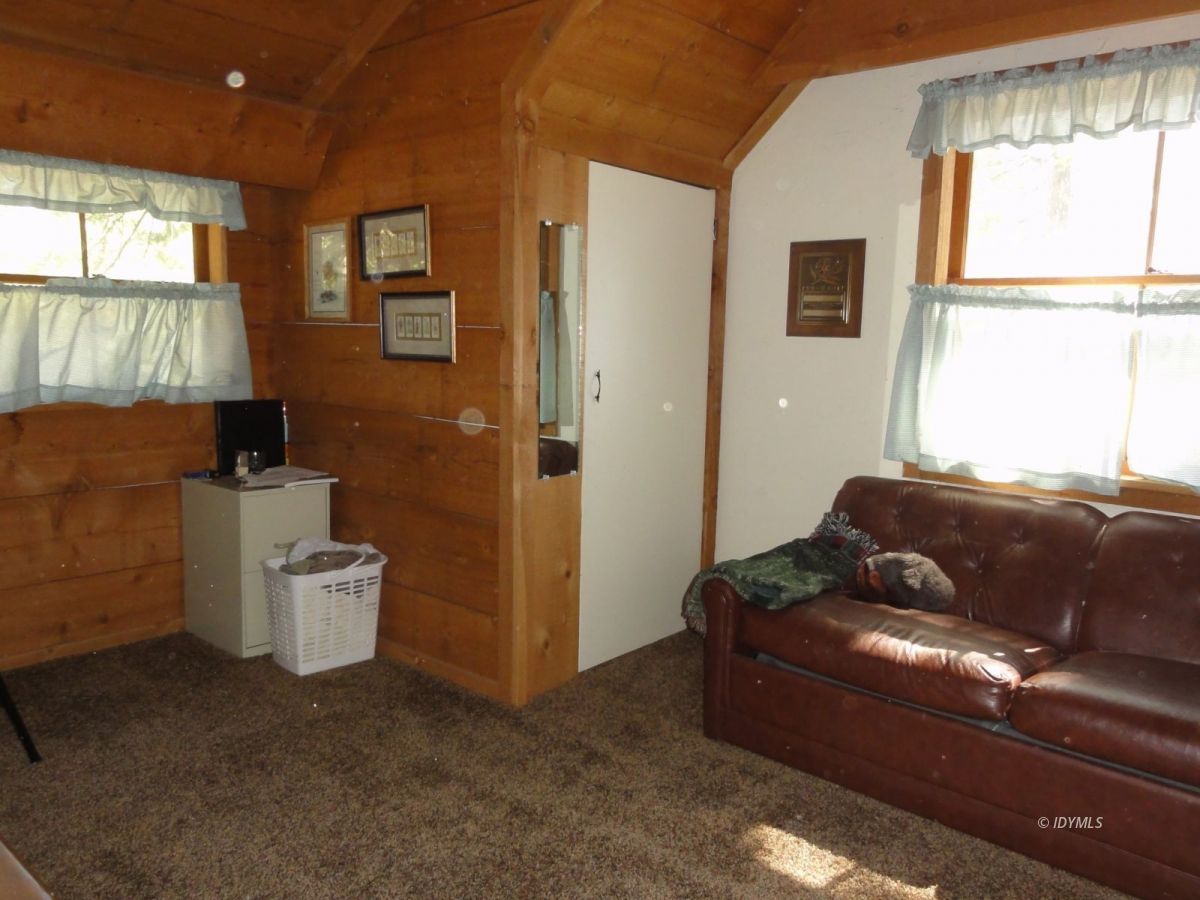 24945 Fern Valley Road Idyllwild, CA 92549 - Photo 21 of 28 a living room with furniture and a window