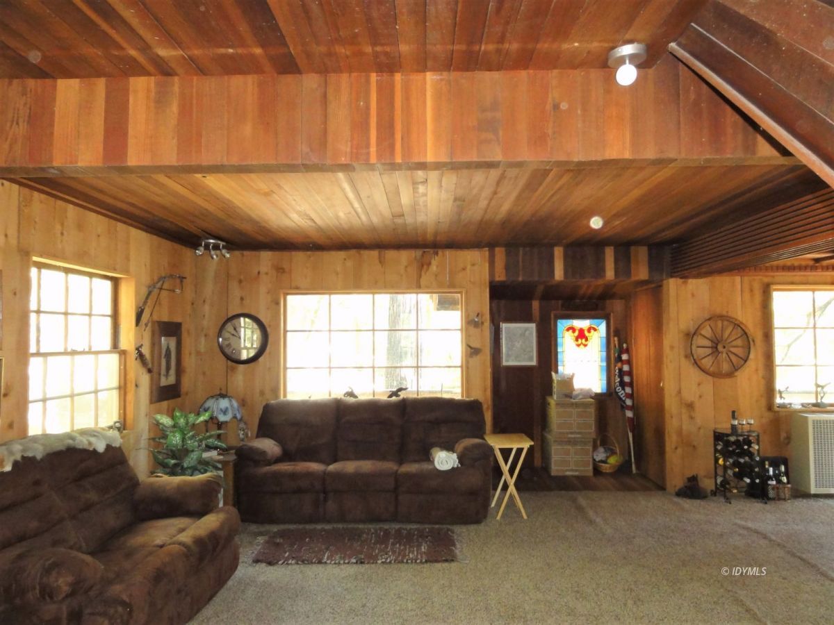 24945 Fern Valley Road Idyllwild, CA 92549 - Photo 22 of 28 a living room with furniture and a large window