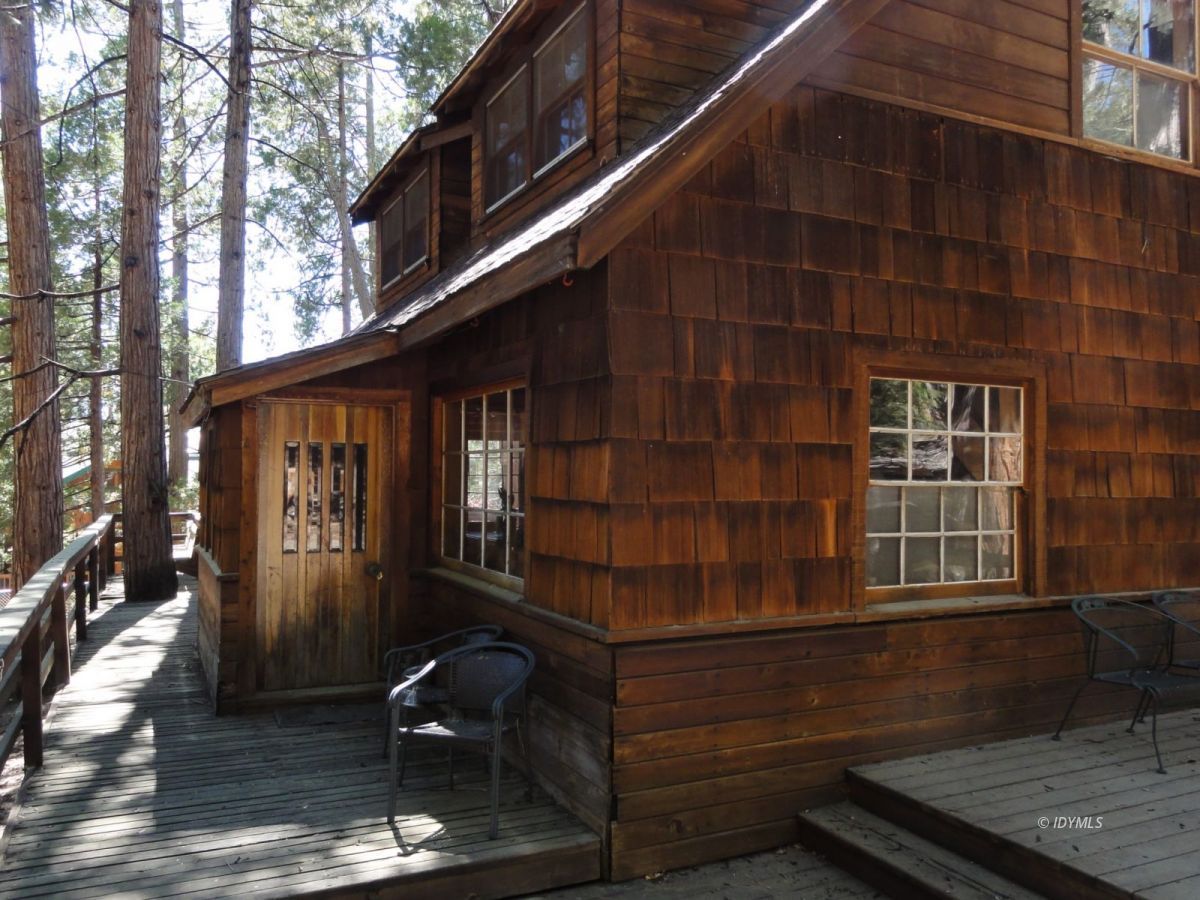 24945 Fern Valley Road Idyllwild, CA 92549 - Photo 5 of 28 a front view of a house with parking area