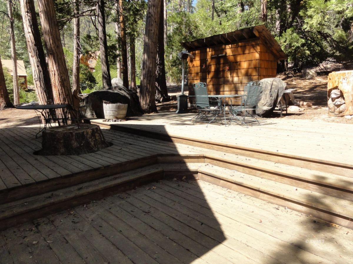 24945 Fern Valley Road Idyllwild, CA 92549 - Photo 6 of 28 a view of a swimming pool with a bench