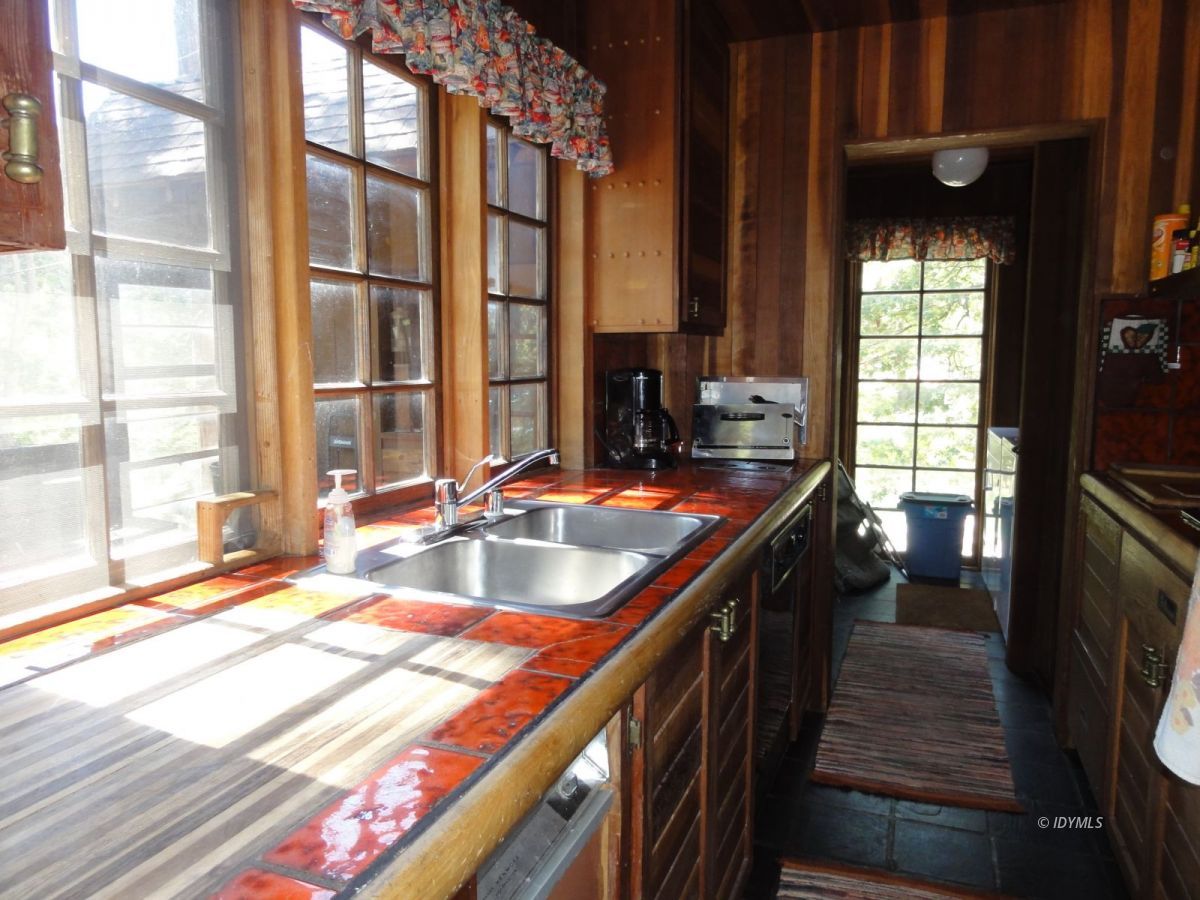 24945 Fern Valley Road Idyllwild, CA 92549 - Photo 10 of 28 a kitchen with sink and view of living room