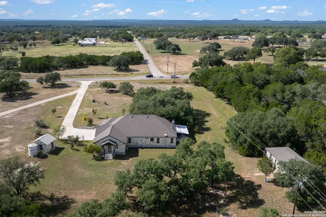an aerial view of a house with a garden