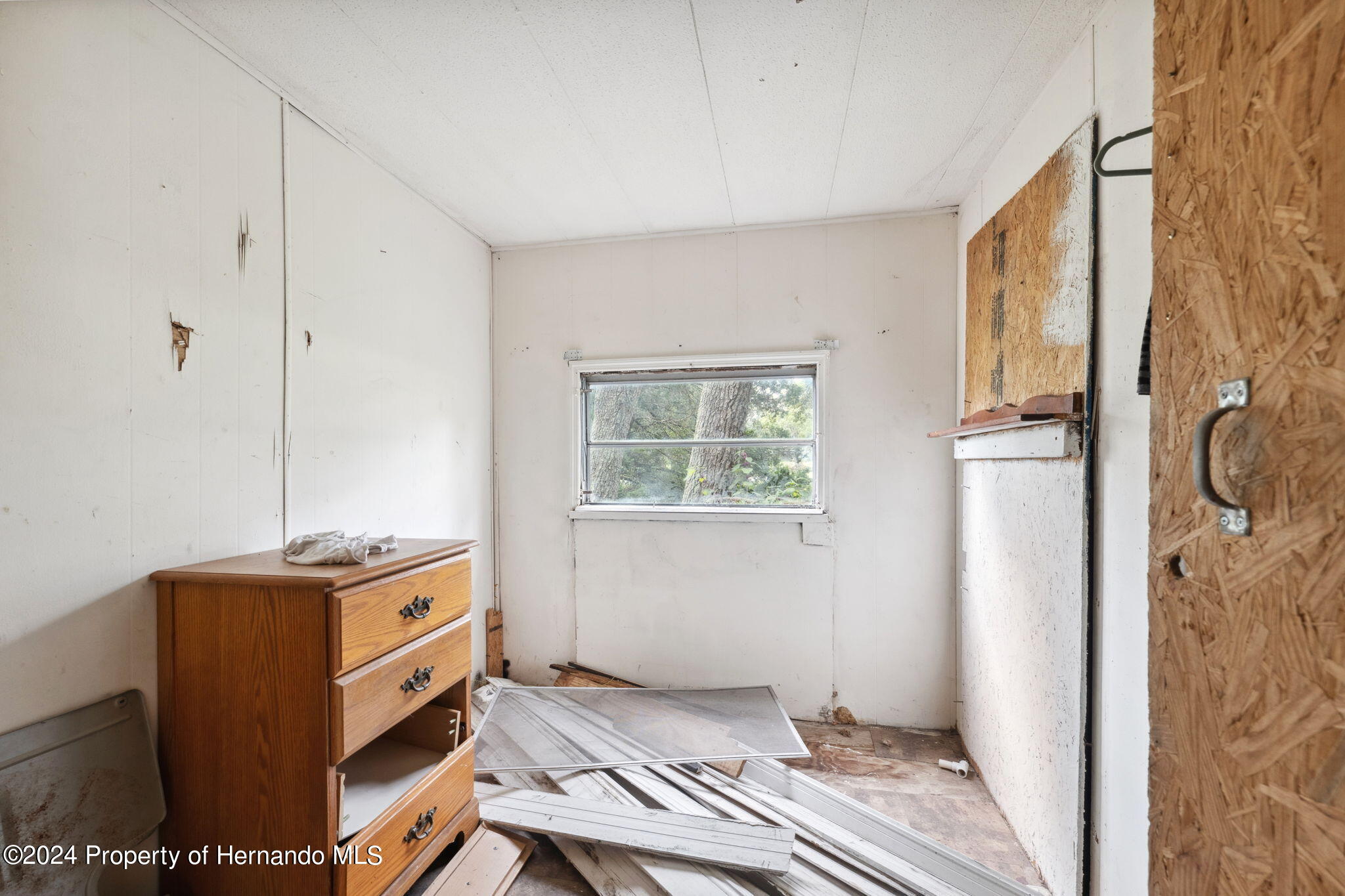 11017 Knuckey Road Weeki Wachee, FL 34614 - Photo 12 of 39 a room with storage and utility