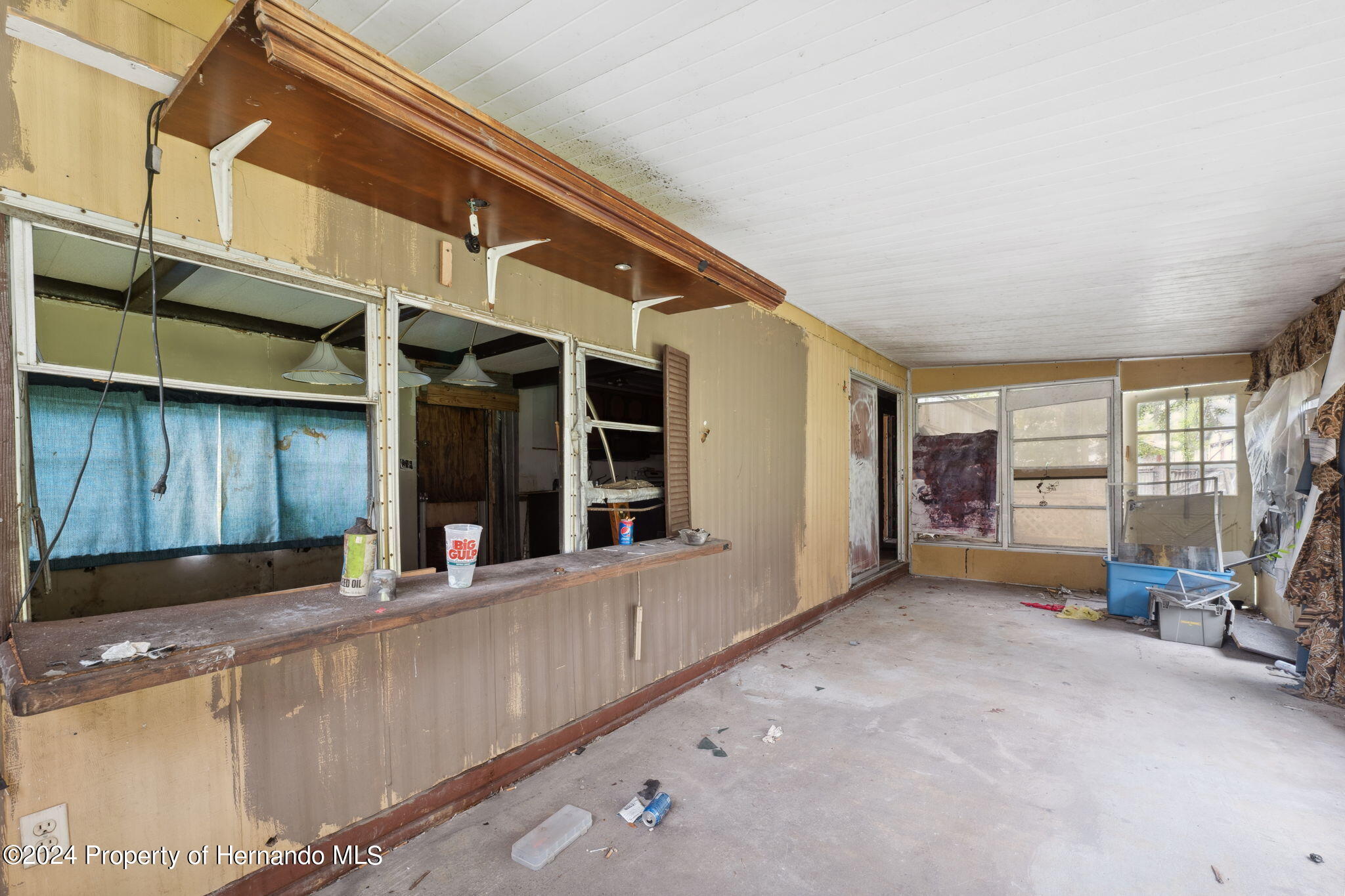 11017 Knuckey Road Weeki Wachee, FL 34614 - Photo 16 of 39 a view of a house with a large window