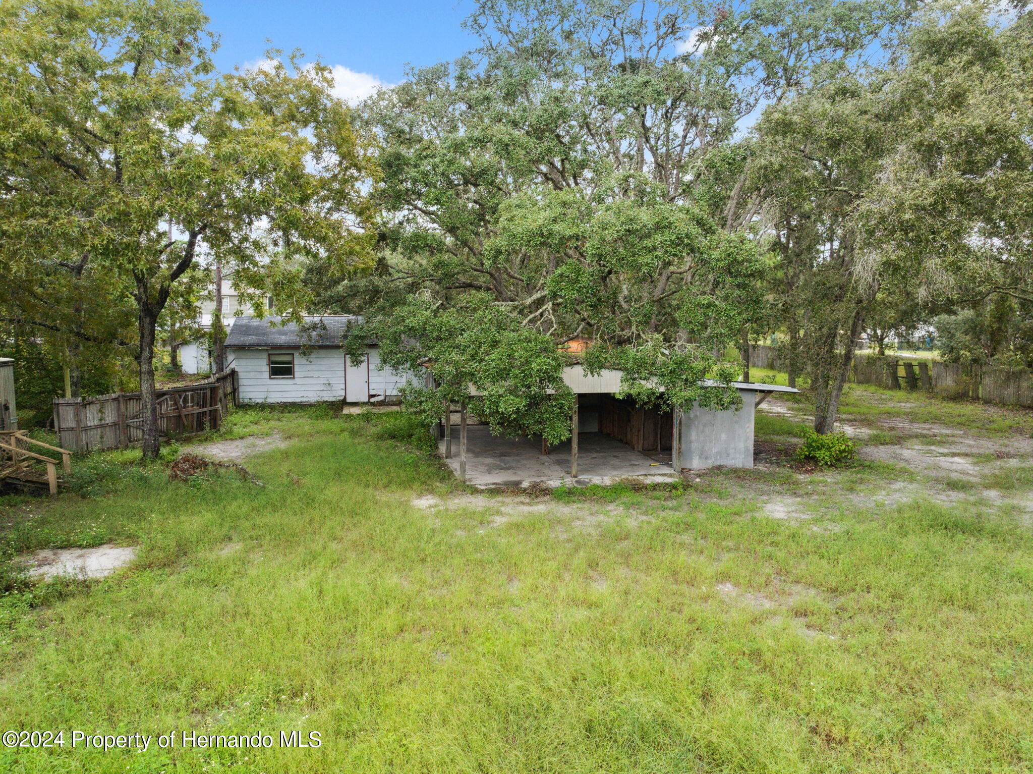 11017 Knuckey Road Weeki Wachee, FL 34614 - Photo 29 of 39 a view of a garden with a bench