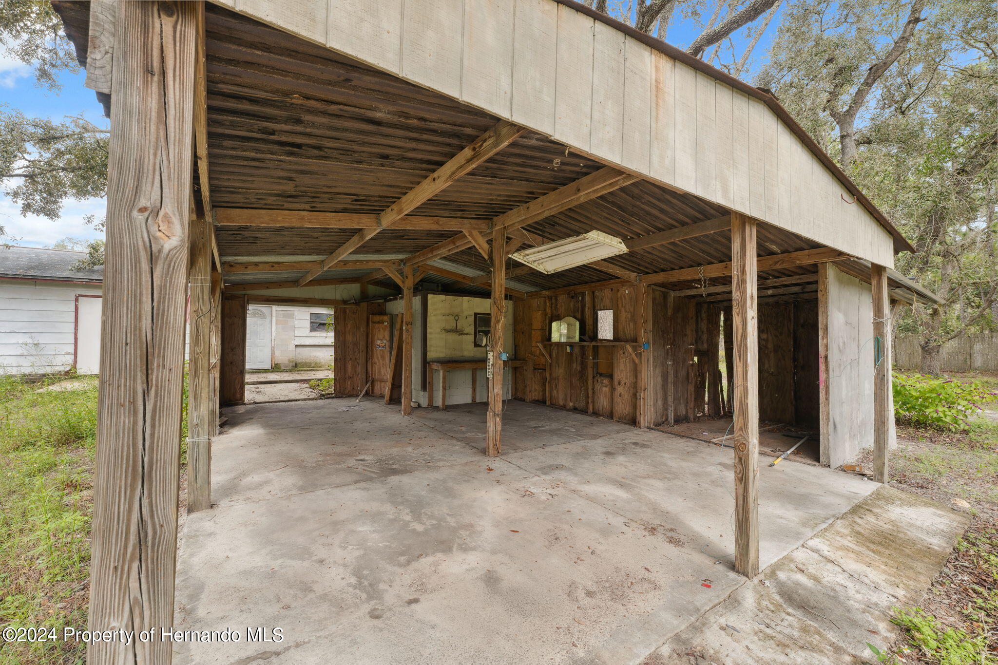 11017 Knuckey Road Weeki Wachee, FL 34614 - Photo 6 of 39 a view of an house with backyard