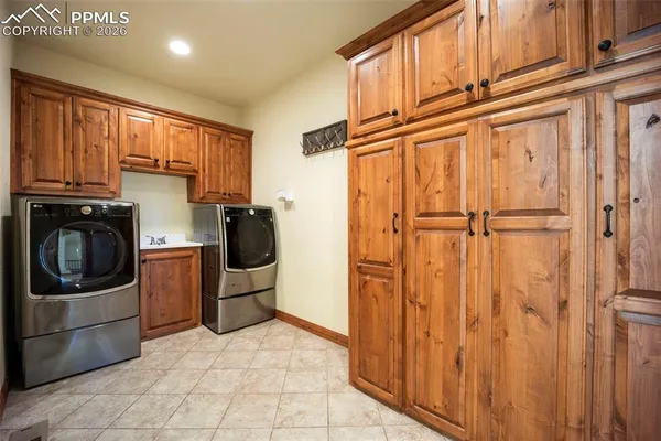 a kitchen with a refrigerator and cabinets