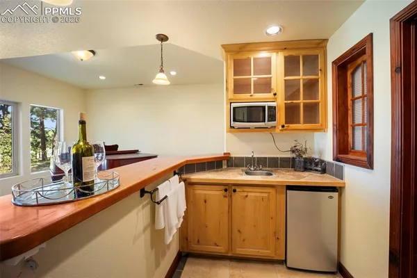 a kitchen with a sink stove and microwave