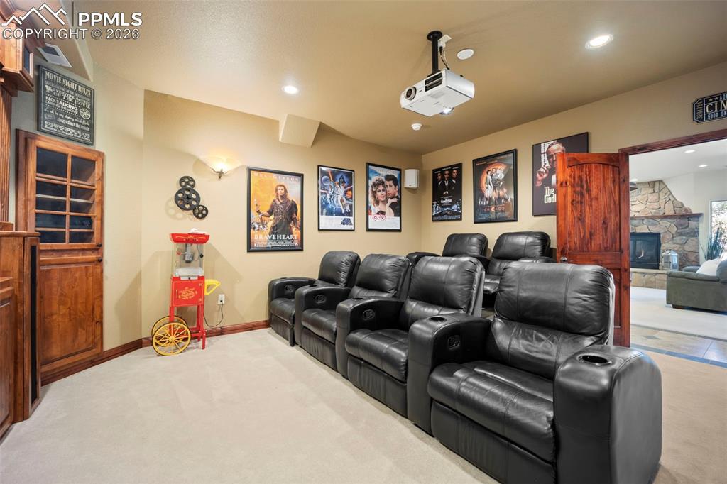 18525 Glenthorne Lane Monument, CO 80132 - Photo 32 of 49 a living room with furniture and a flat screen tv
