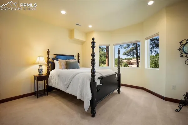 a bed room with a bed and a night stand