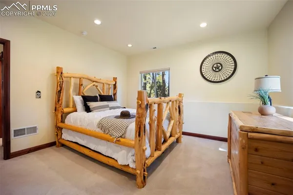 a bed room with a bed and a table