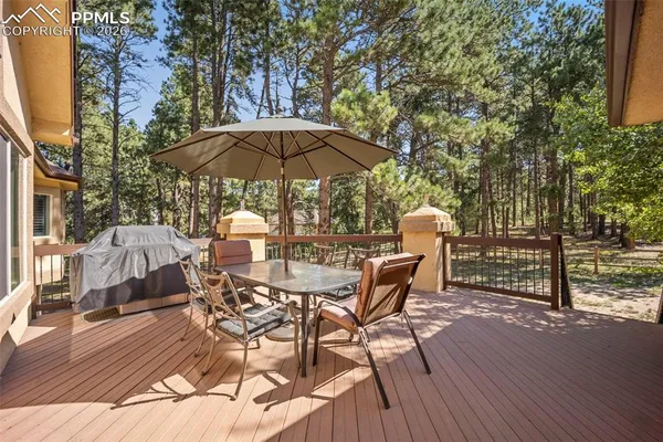 a view of a chairs and table on the wooden floor
