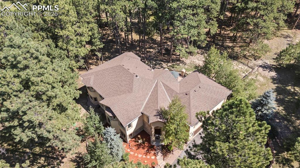 18525 Glenthorne Lane Monument, CO 80132 - Photo 43 of 49 an aerial view of a house with a yard and covered with trees