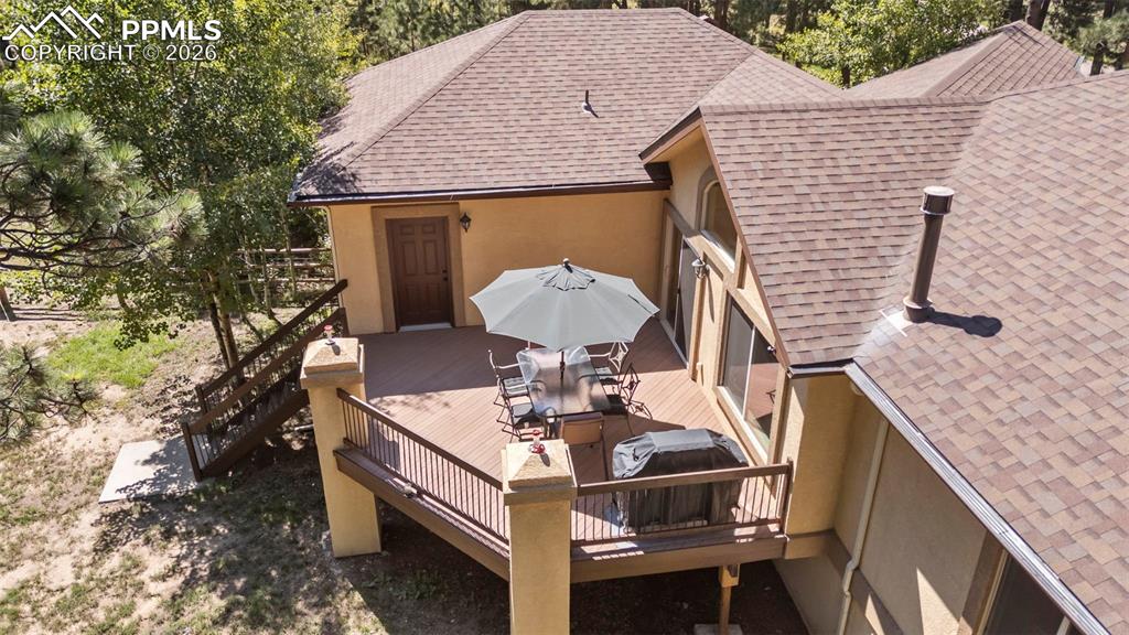 18525 Glenthorne Lane Monument, CO 80132 - Photo 46 of 49 a terrace with outdoor seating and trees