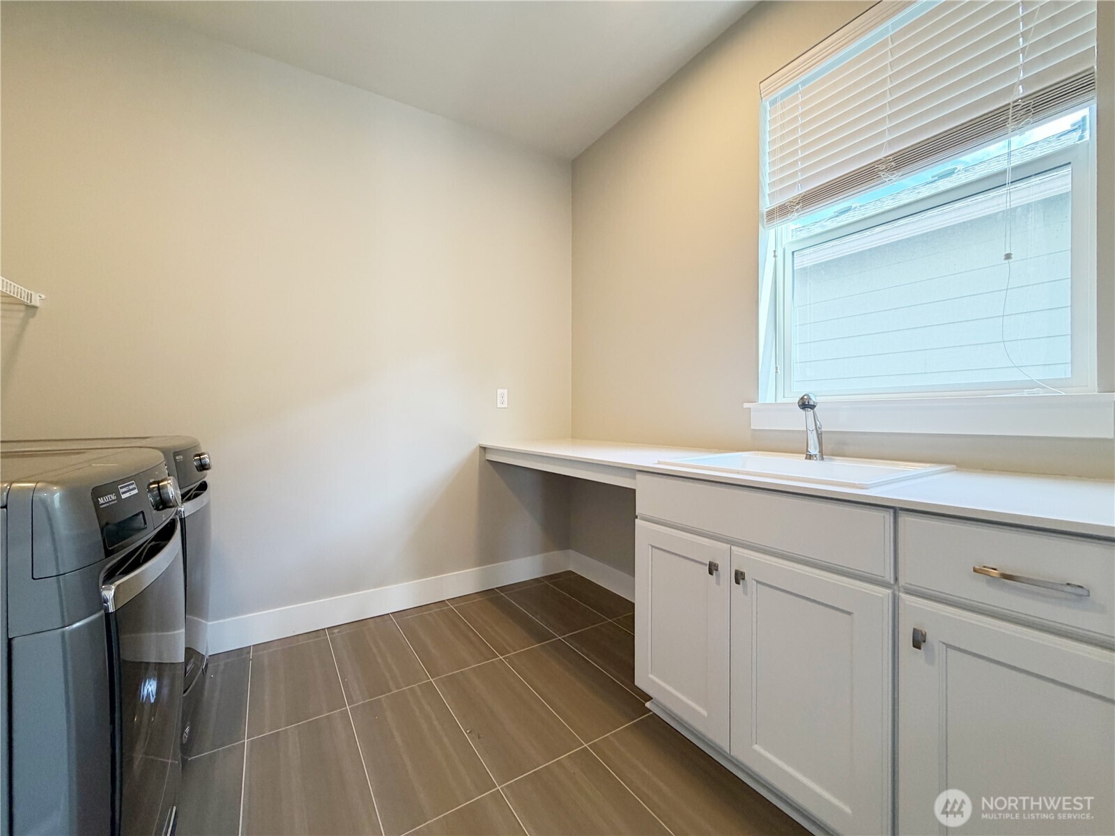 16529 White Mountain Road Southeast Monroe, WA 98272 - Photo 28 of 34 a room with a sink and cabinets
