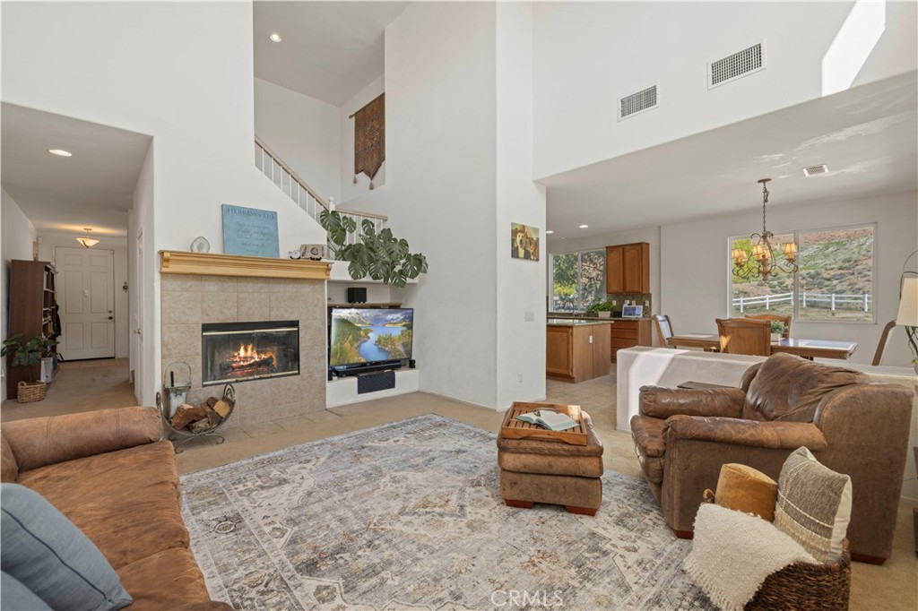 34250 McEnnery Canyon Road Acton, CA 93510 - Photo 16 of 63 a living room with furniture and a fireplace