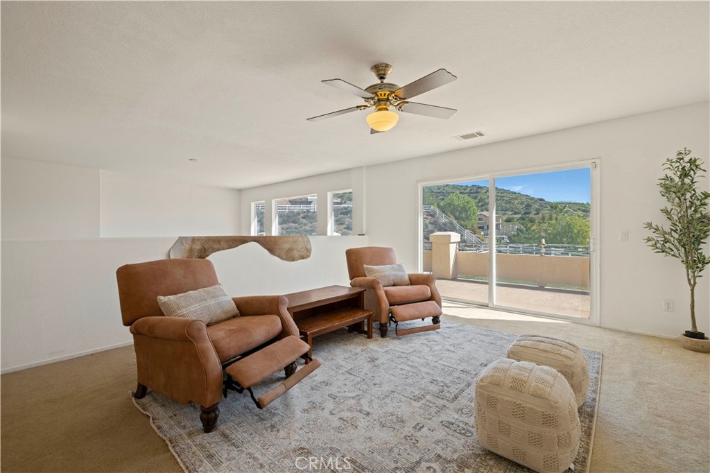 34250 McEnnery Canyon Road Acton, CA 93510 - Photo 28 of 63 a living room with furniture and a large window