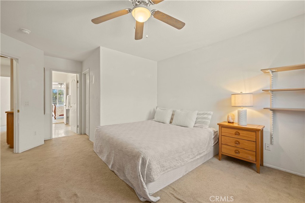 34250 McEnnery Canyon Road Acton, CA 93510 - Photo 36 of 63 a bedroom with a bed and a chandelier