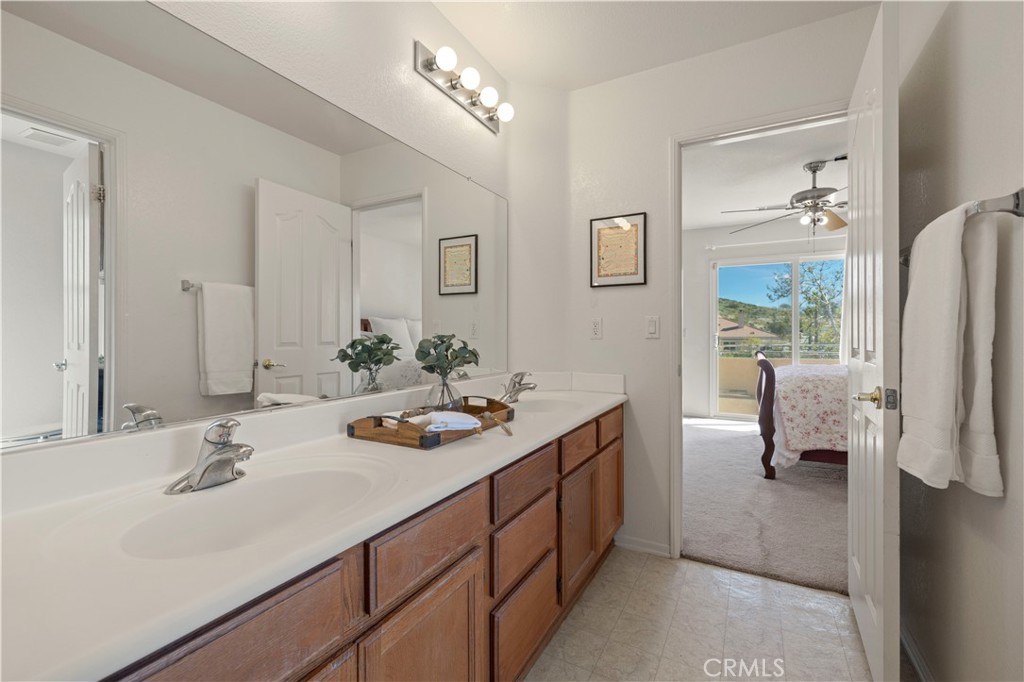 34250 McEnnery Canyon Road Acton, CA 93510 - Photo 37 of 63 a en suite bathroom with double sink and a mirror