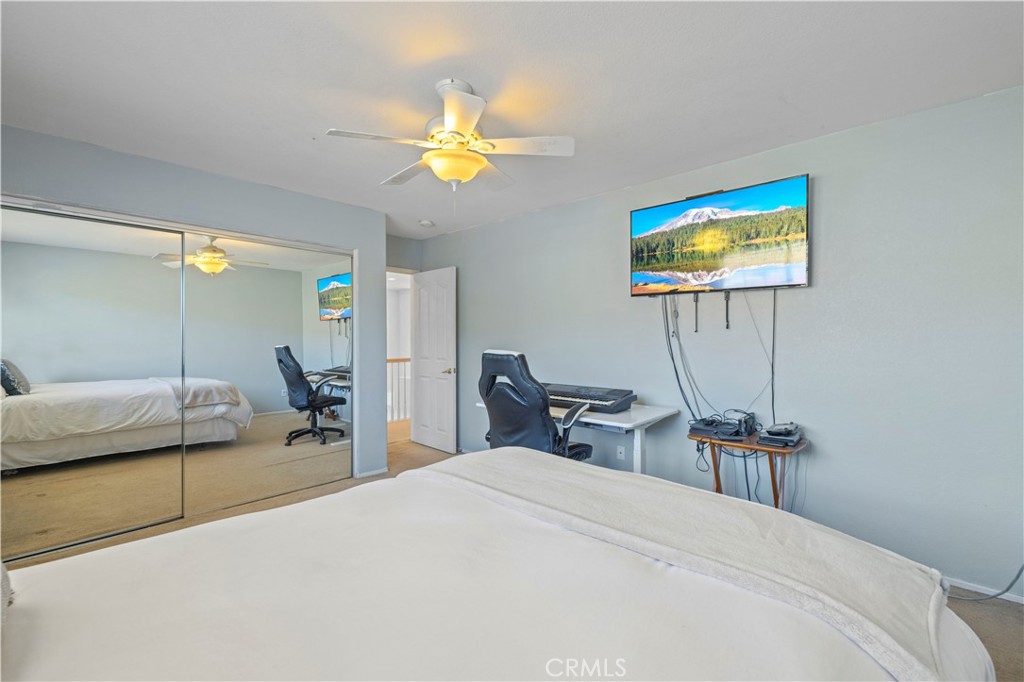 34250 McEnnery Canyon Road Acton, CA 93510 - Photo 42 of 63 a bedroom with a bed and a table