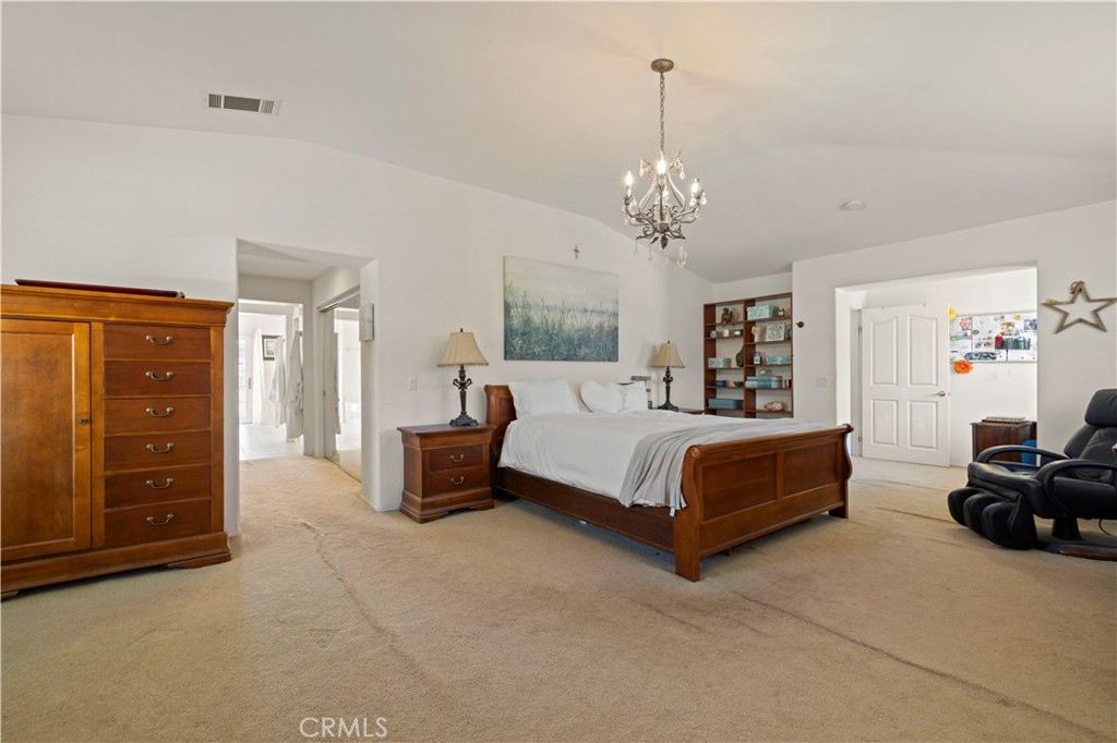 34250 McEnnery Canyon Road Acton, CA 93510 - Photo 44 of 63 a spacious bedroom with a bed and dresser