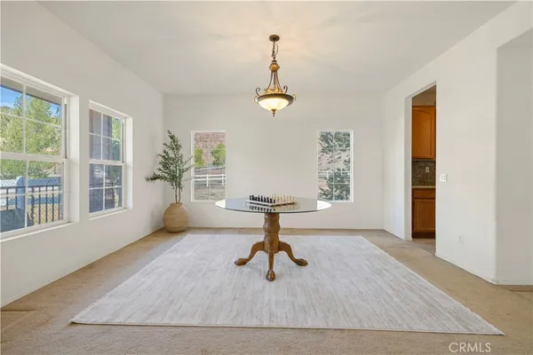 a living room with furniture and windows