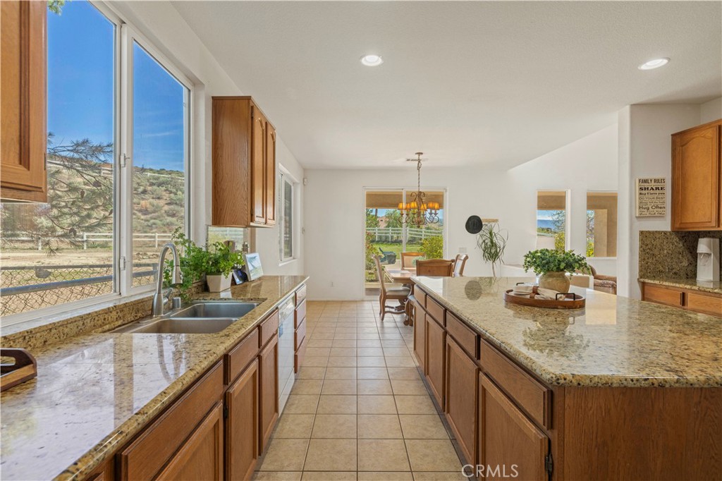 34250 McEnnery Canyon Road Acton, CA 93510 - Photo 7 of 63 a kitchen with granite countertop a sink and a stove