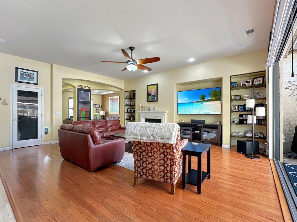 10555 Hampton Creek Drive Reno, NV 89521 - Photo 11 of 50 a living room with fireplace furniture and a wooden floor