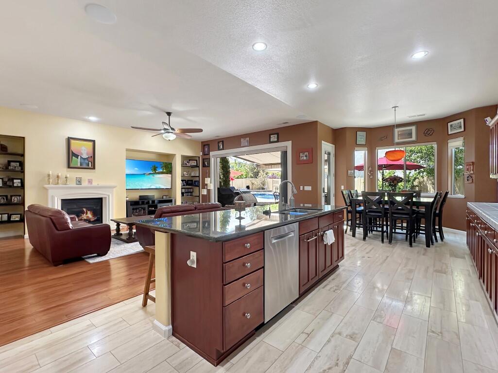 10555 Hampton Creek Drive Reno, NV 89521 - Photo 14 of 50 a kitchen with furniture and a fireplace