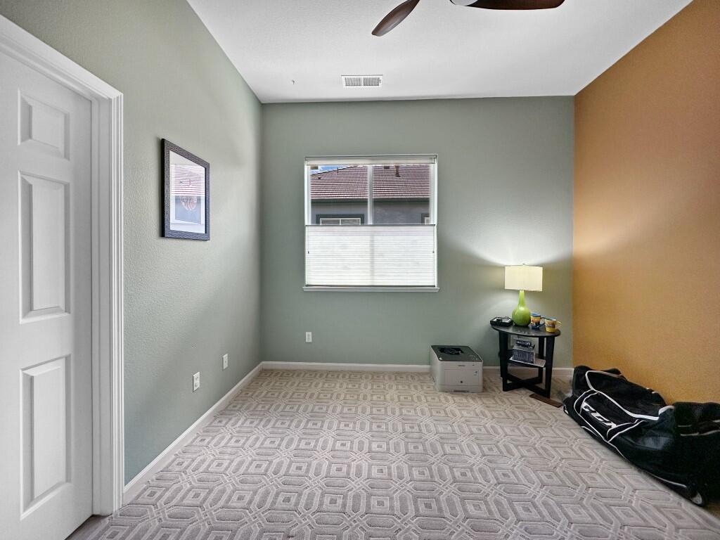 10555 Hampton Creek Drive Reno, NV 89521 - Photo 28 of 50 a bedroom with a bed and a window