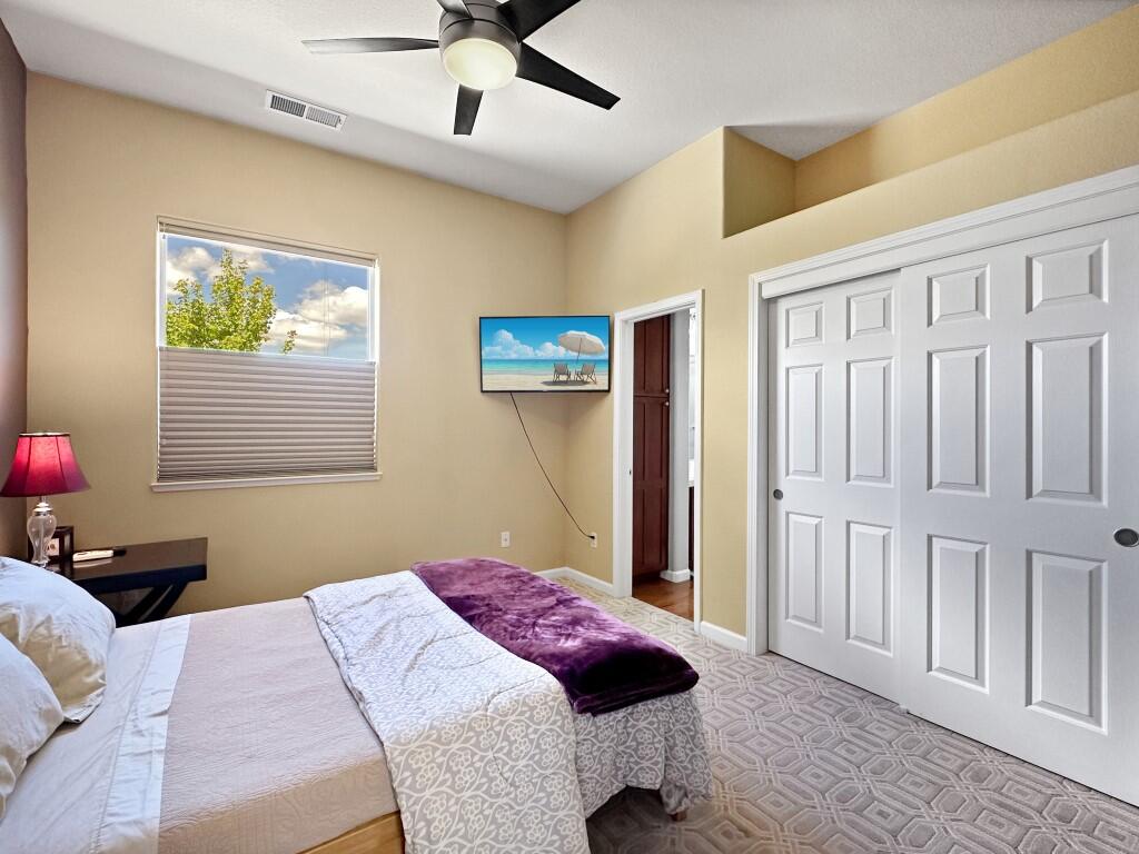10555 Hampton Creek Drive Reno, NV 89521 - Photo 31 of 50 a bedroom with a bed dresser and a window