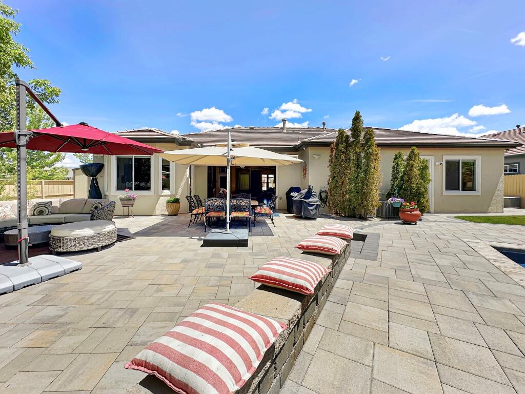 10555 Hampton Creek Drive Reno, NV 89521 - Photo 42 of 50 a view of a patio with dining table and chairs