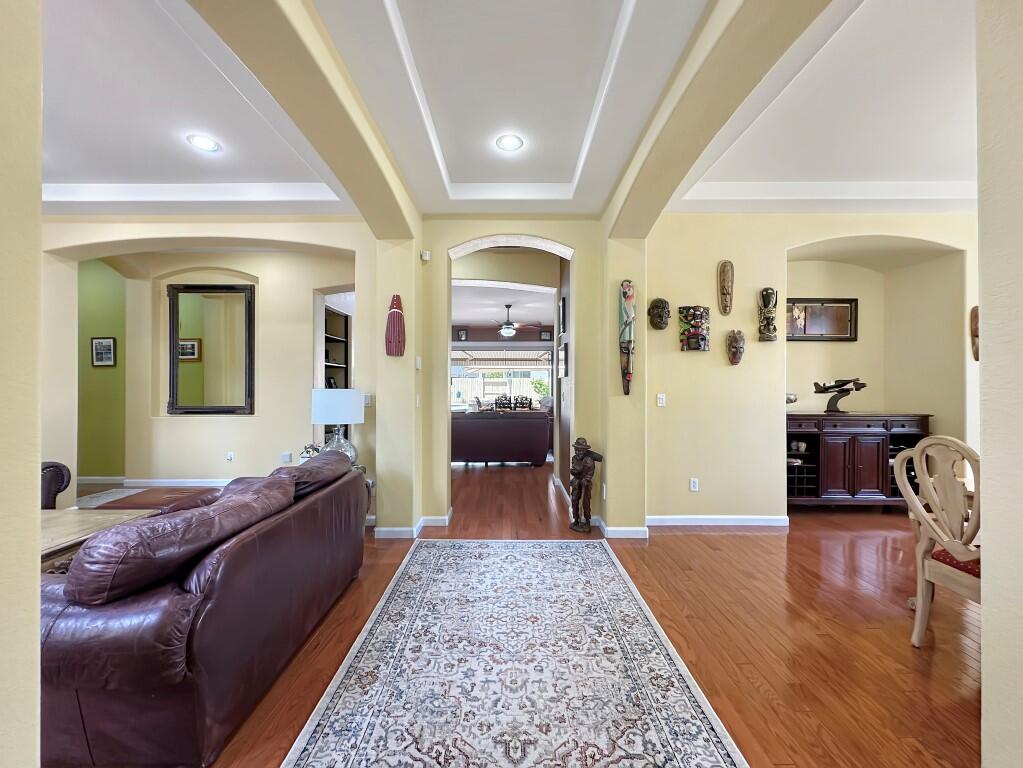 10555 Hampton Creek Drive Reno, NV 89521 - Photo 5 of 50 a living room with furniture and a wooden floor