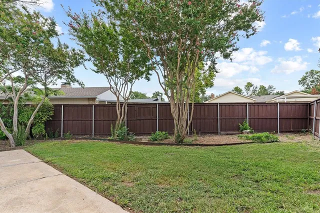 a backyard of a house with lots of green space