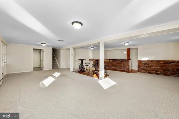 a view of a hall with wooden floors