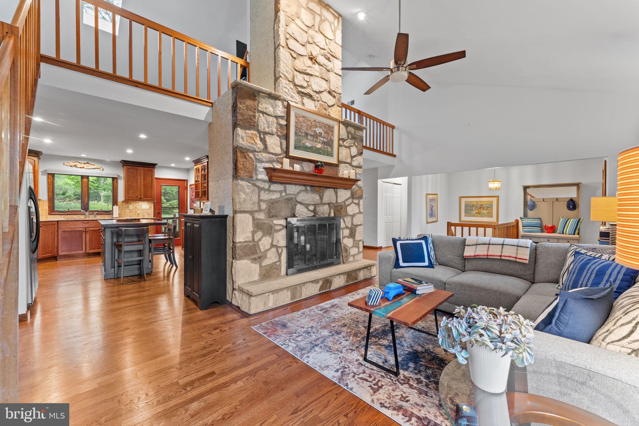 4 Fox Ridge Road Glenmoore, PA 19343 - Photo 9 of 47 Floor-to-ceiling stone hearth fireplace.