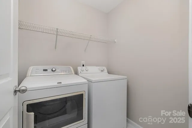 a bathroom with a sink toilet and a mirror