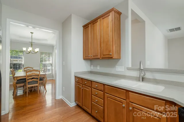 a kitchen with stainless steel appliances granite countertop a sink and cabinets
